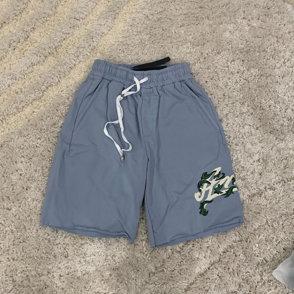 Amiri Blue Washed Flared AM Filigree Logo Shorts